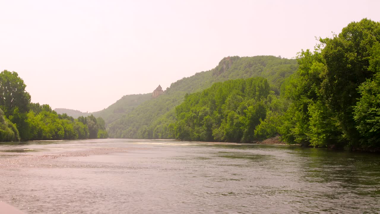 Dordogne river view with castle in France, tranquil and scenic landscape