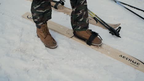 person wearing snowshoes and walking on snow