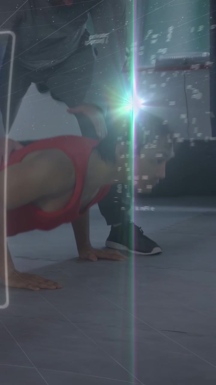 Vertical video: Trainee doing pushups in gym coach cueing feet alignment, HUD showing fitness form