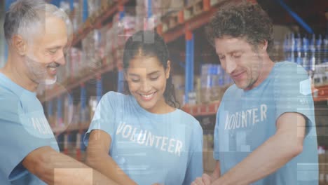 statistical data processing over diverse male and female volunteers making a hand stack at warehouse