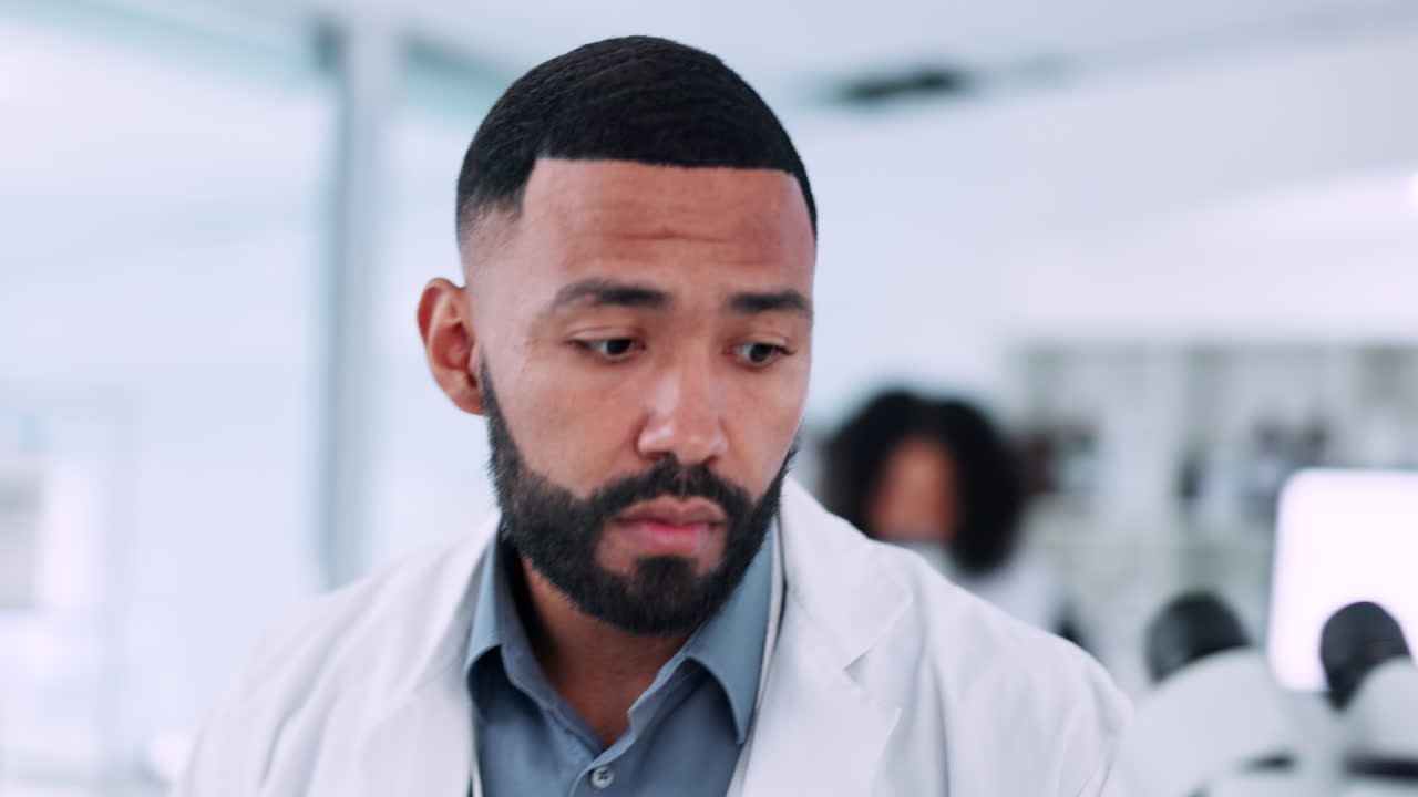 Scientist, man and microscope