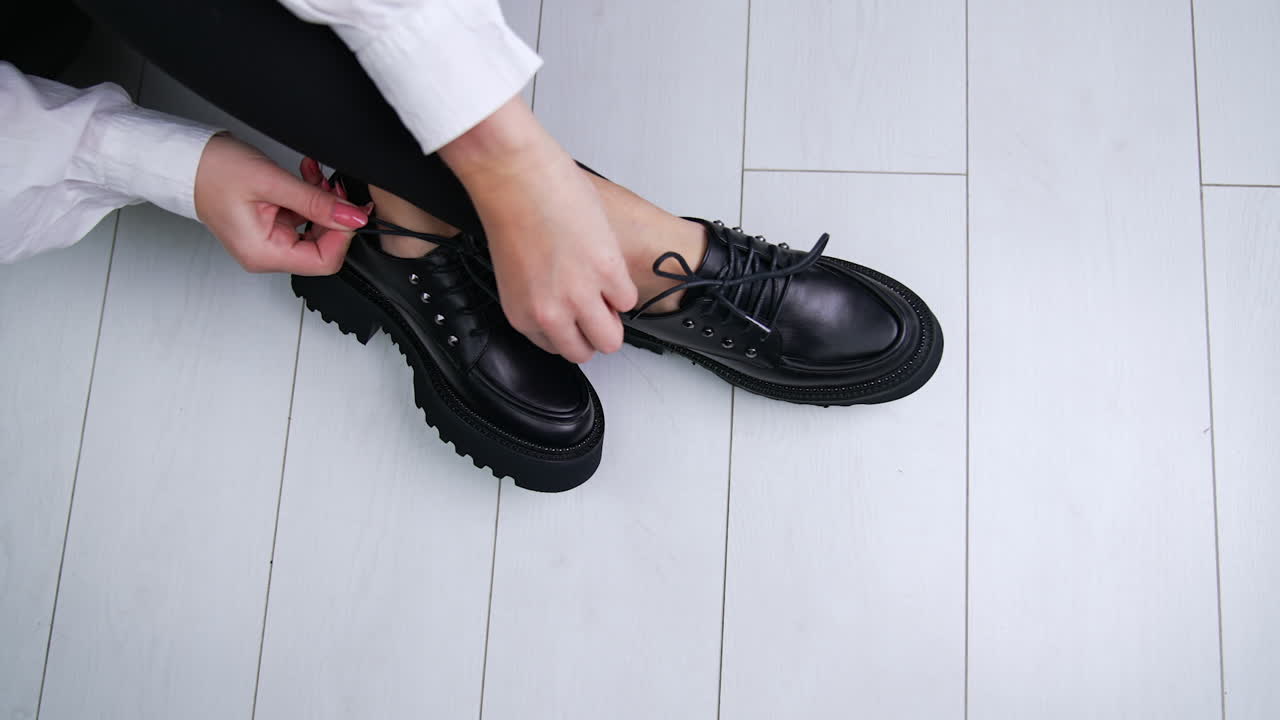 Woman wearing black platform shoes