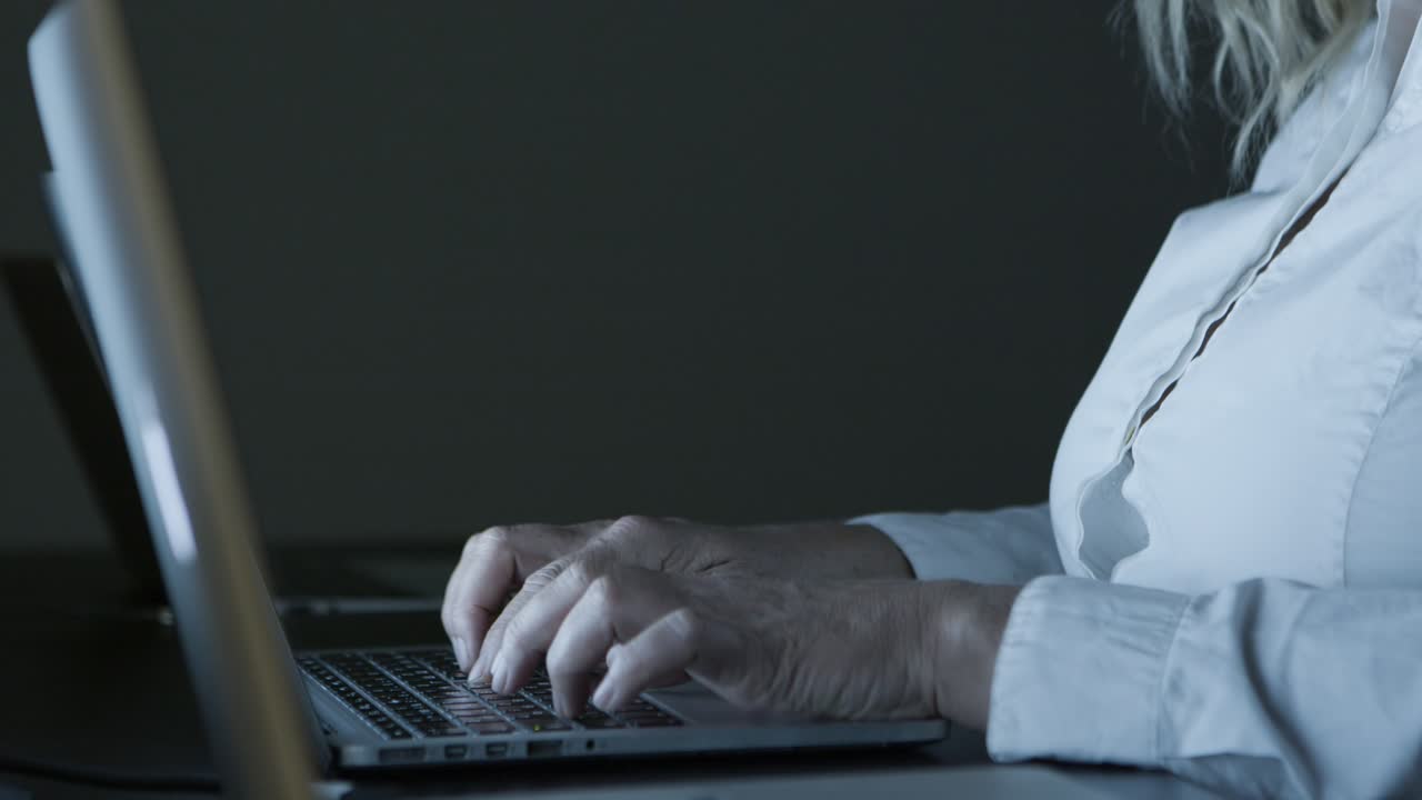 Cropped shot of businesswoman typing on laptop