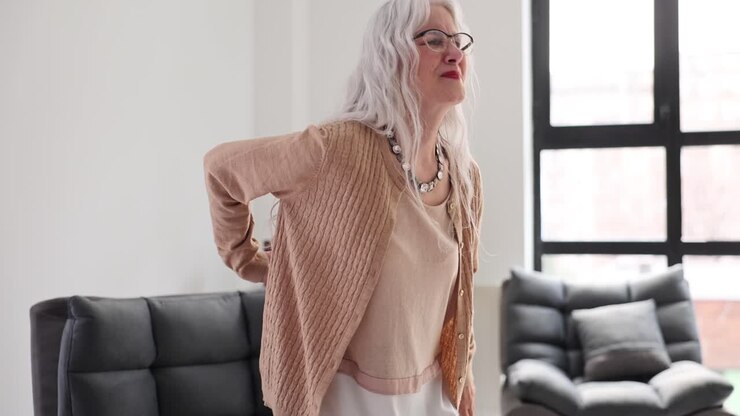 Elderly Woman Experiencing Back Pain