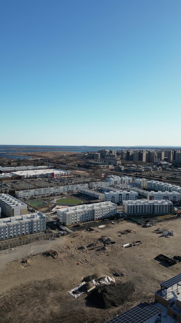 Aerial view over Brooklyn featuring Belt Parkway, Shirley Chisholm State Park, Spring Creek Beach, Pennsylvania Ave, Flatlands Ave, and Howard Beach.