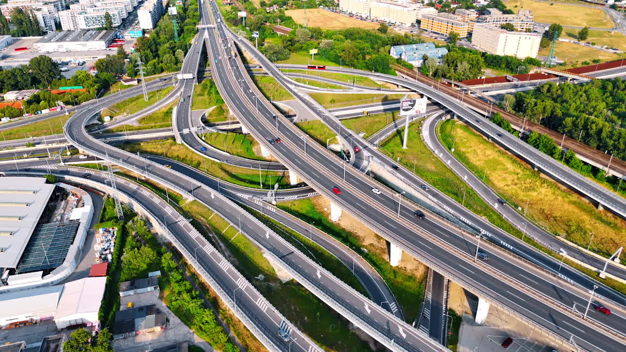 Complex highway interchange in Europe. View of a busy highway interchange with multiple lanes and connections in an urban European setting on a sunny day
