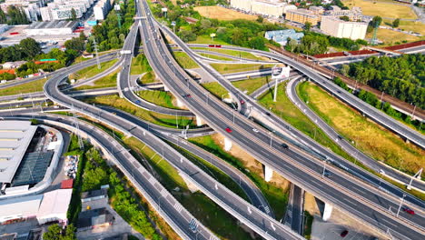 complex highway interchange in europe. view of a busy highway interchange with multiple lanes and connections in an urban european setting on a sunny day