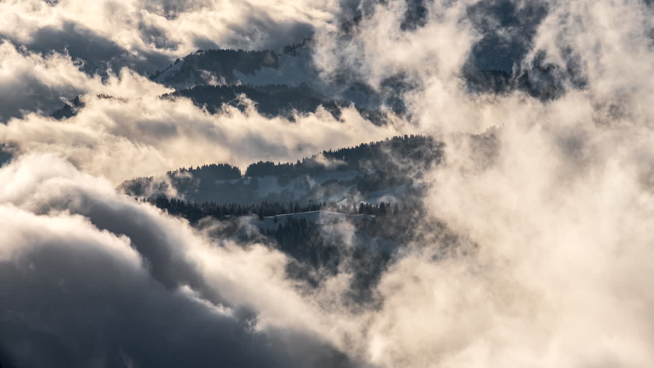 High angle timelapse of clouds blowing over Avoriaz Ski Resort in French Alps