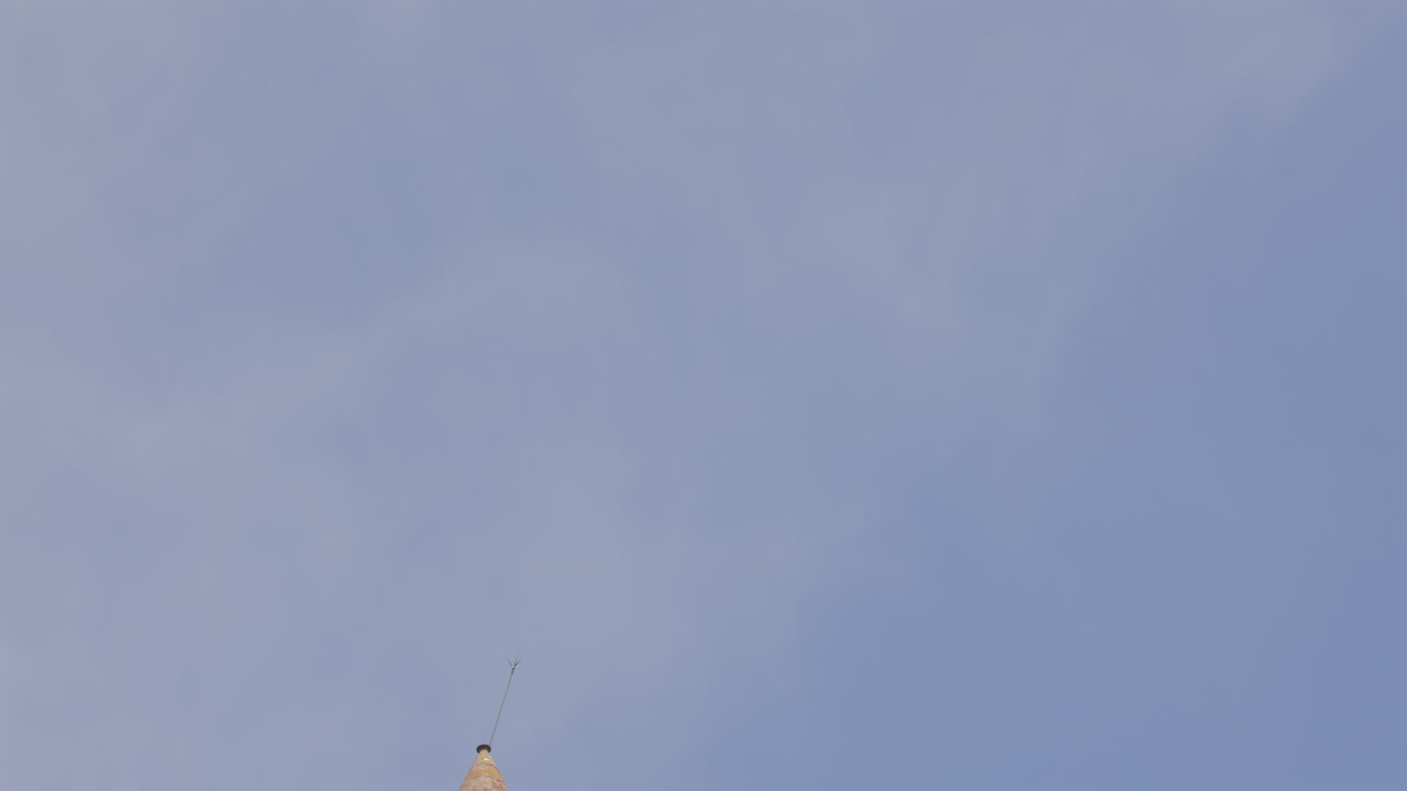 Tilting down shot of the Airlie tower on Tulloch Hill near near Kirriemuir