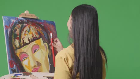 woman painting a portrait