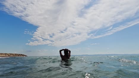 woman in bikini swimming in the ocean