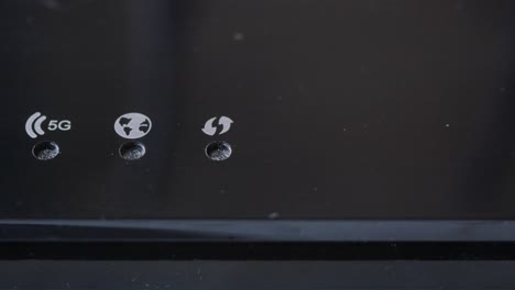 close-up of a wireless router with connectivity symbols