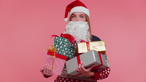 Girl-in-Christmas-fake-beard-of-Santa-Claus-surprised-of-present-boxes-excited-by-many-holiday-gifts