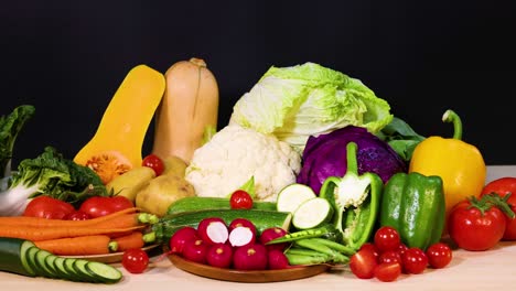 assorted vegetables arranged on a black background