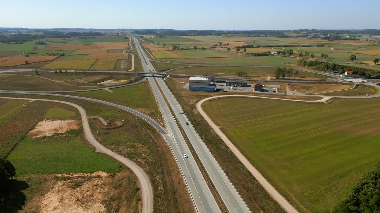 Panoramic drone view of expressway S8 highway road through agricultural fields