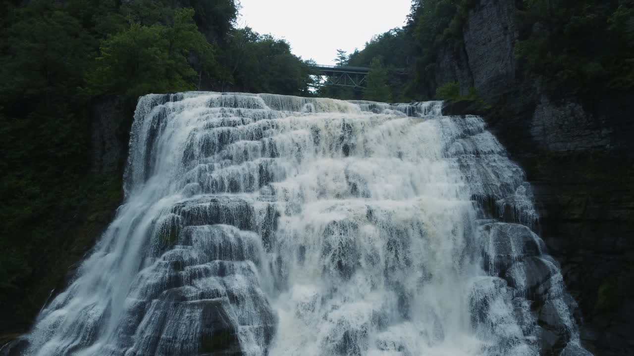 Ithaca Falls has a 150ft drop and width of 175ft, The falls are in an amphitheater formed by freezing and thawing of shale, which makes up the gorge walls