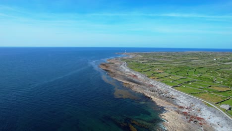 inisheer aran islands drone landscape deep blue seas and rocky coastline to headland with lighthouse