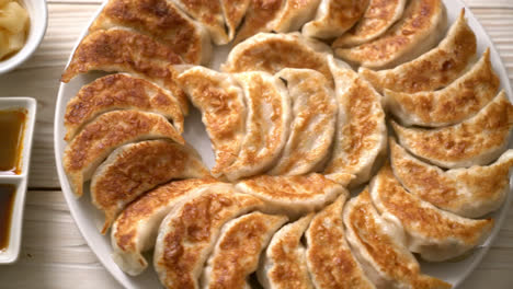 fried gyoza or dumplings snack with soy sauce in japanese style