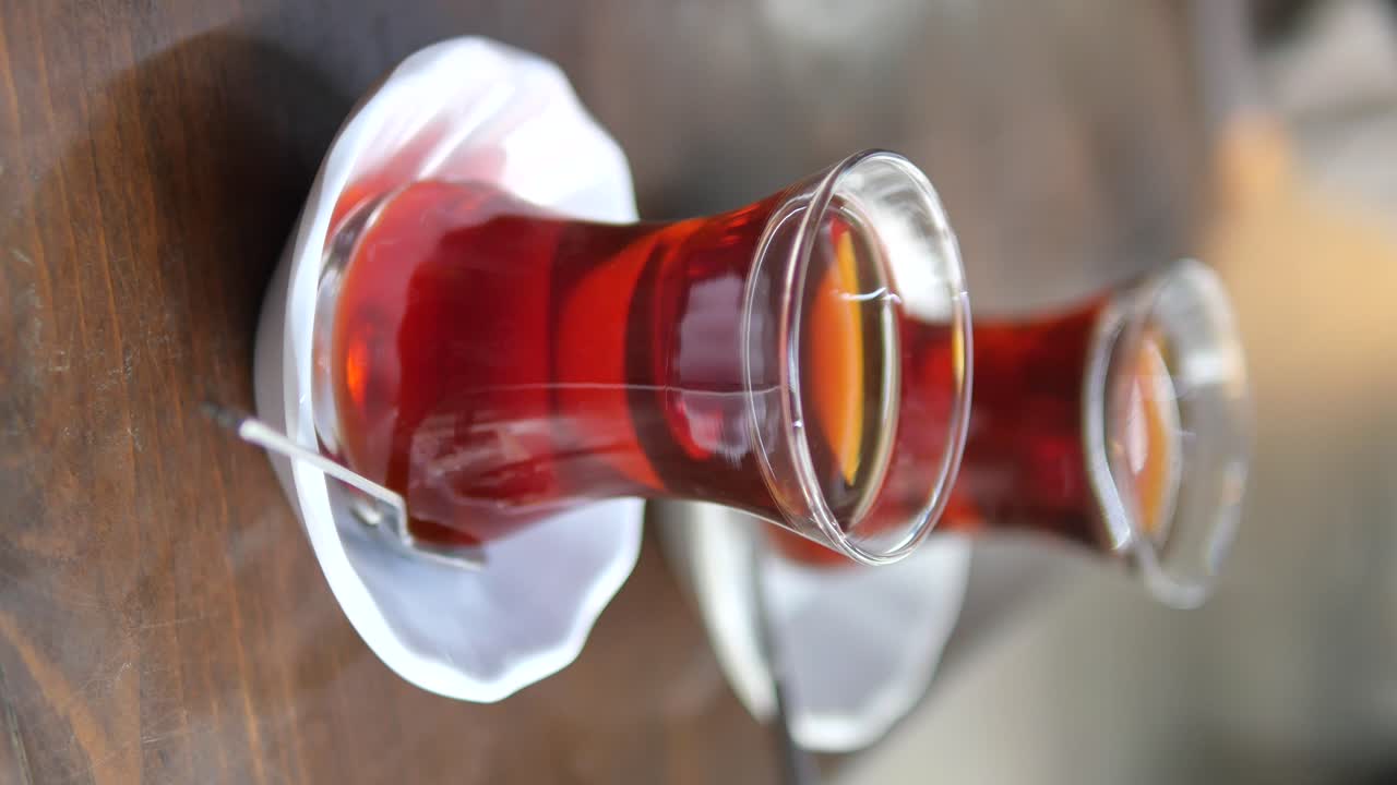 Two Glasses of Turkish Tea on a Wooden Table