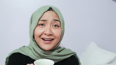 Female-Student-Talking-and-Raising-Glass-Directly-to-Camera