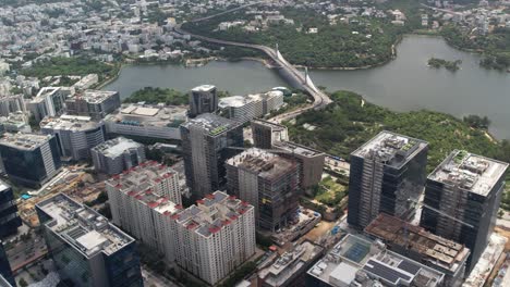 drone shot of commerial area and city connects via cable bridge