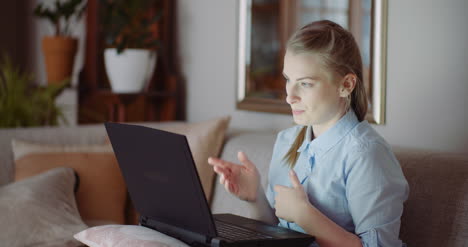 video conference on laptop at home office businesswoman video chatting with client 1