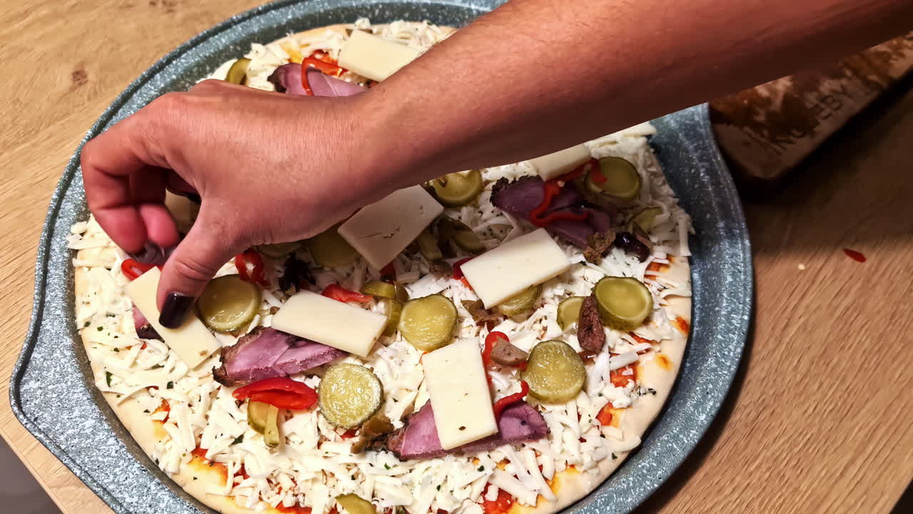 Homemade pizza with cold cuts and cheese, shot in close-up, Jelgava, Latvia