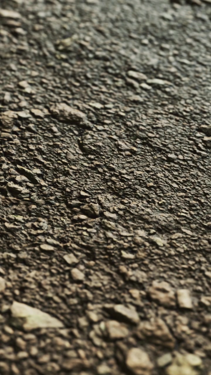 Rough stones and gravel covering outdoor path during daytime