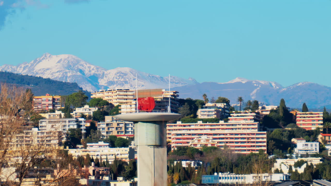 View of the radar antenna at Nice airport, France, mountains in the background