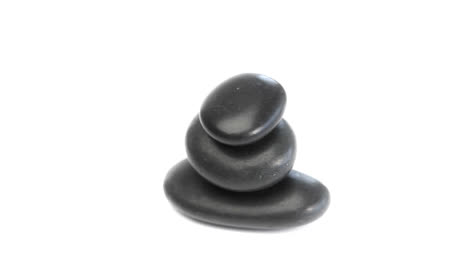 Black-pebbles-rotating-