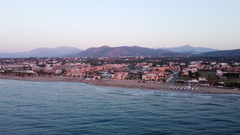 aerial flying towards analipsi beach at sunset, crete, greece
