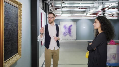 couple viewing art in an art gallery