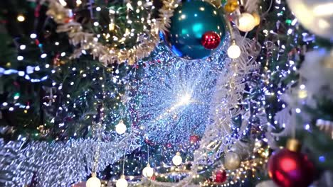 a close-up shot of a beautifully decorated christmas tree with twinkling lights and ornaments