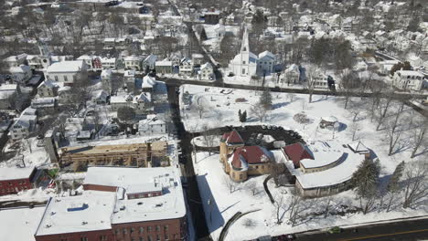 aerial wide angle shot of snow covered city of bath, me, usa.  sideway tracking shot.
