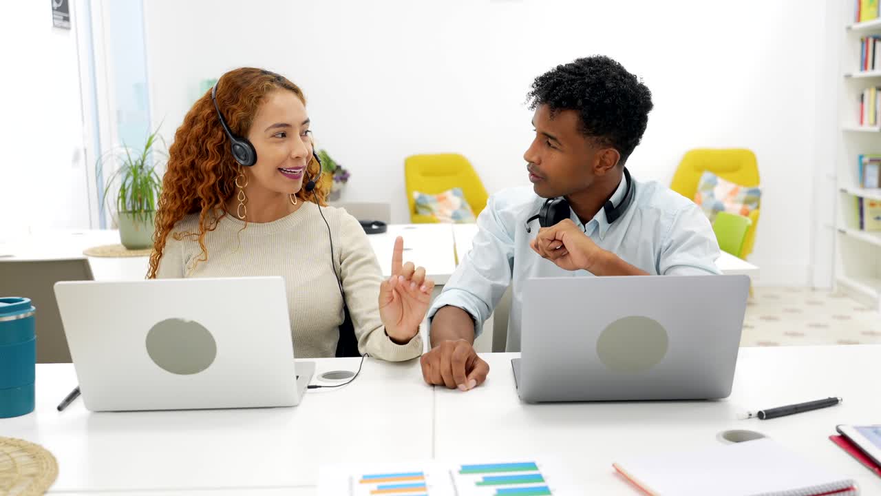 Two colleagues working together in the office