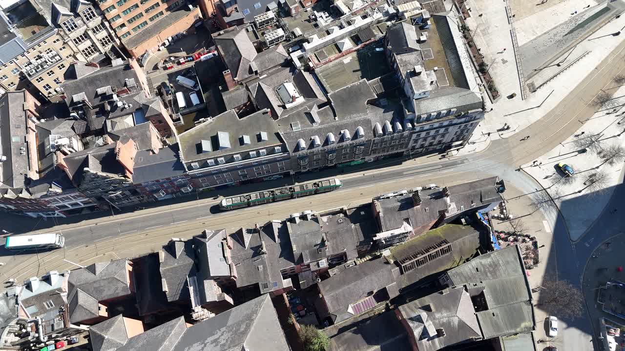 Overhead birds eye drone aerial view tram in Nottingham UK