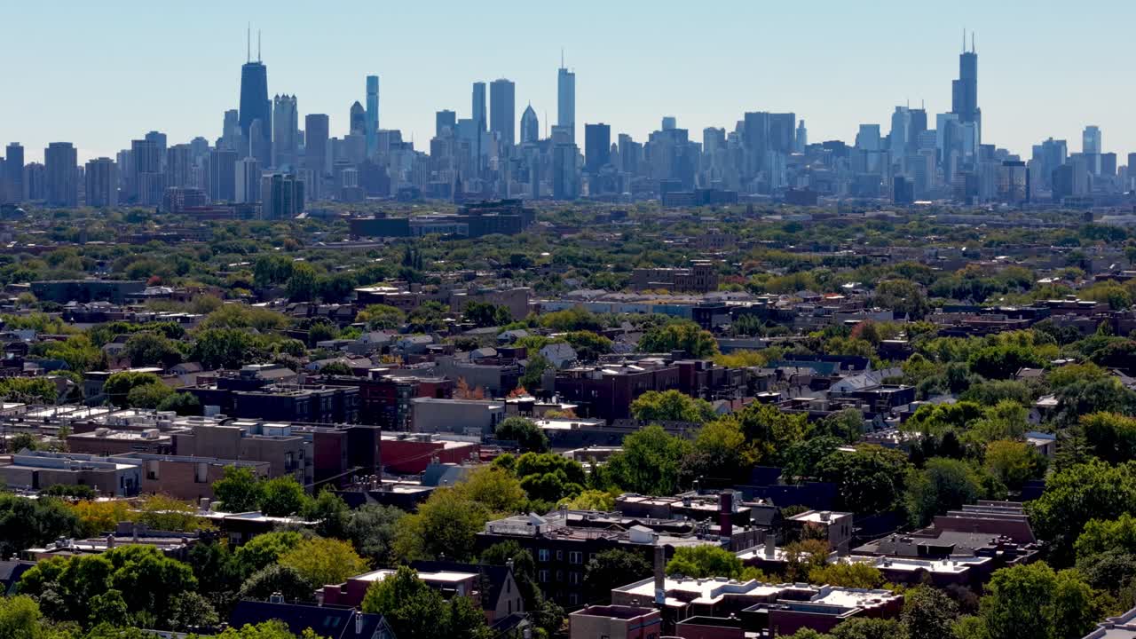 aerial push in over neighborhoods leading to the Chicago Illinois Skyline