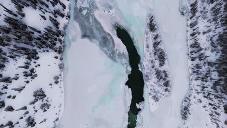 Frozen Kusawa Lake During Winter In Yukon Territory, Canada. aerial topdown shot