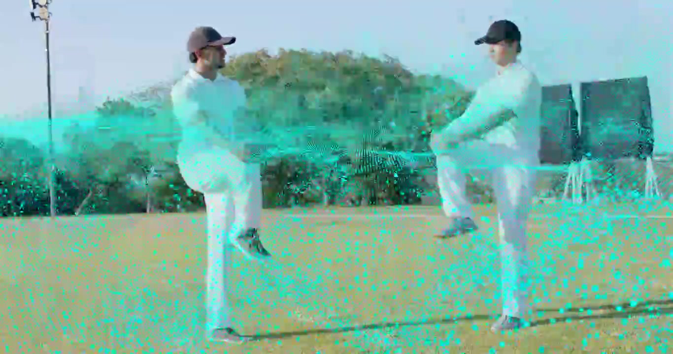 To cricketspillere holder speilvendt positur, turkis bølge feier mellom dem, en går ned
