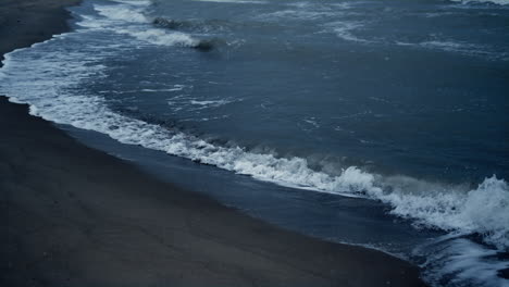Water-waves-splashing-coast-on-dark-natural-environment.-Blue-sea-storm-outside.
