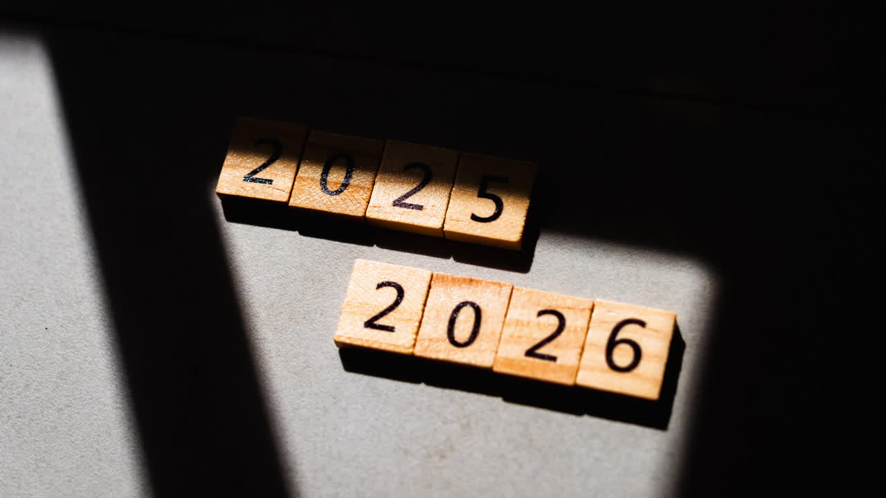 Esta imagen captura de forma creativa los años 2025 y 2026 mediante una técnica minimalista de sombras