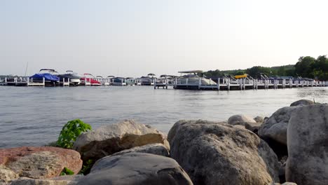 Moored-boats-to-pier-in-an-evening-outside-from-a-distance-nobody