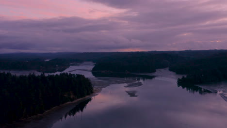 aerial of slough in charleston oregon near coos bay, during a purple and beautiful sunset