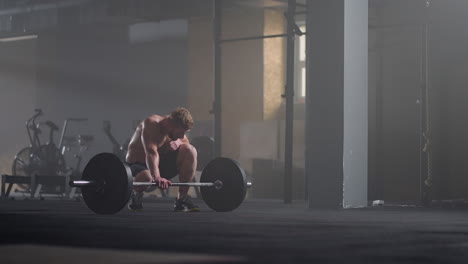 Beautiful-Athletic-man-Wipes-Sweat-from-His-Forehead-with-a-Hand-Looks-into-Camera.-He's-Tired-after-Intensive-Cross-Fitness-Exercise