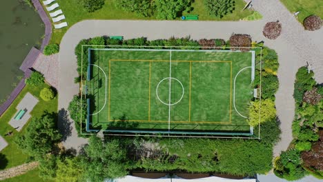 small football pitch. modern sportsground of the recreation complex among nature. resort territory for summer vacation. top view.
