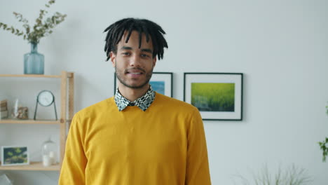 man in a yellow sweater