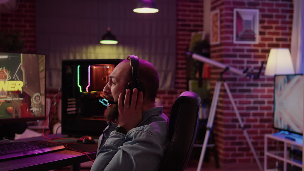 Man playing online first person shooter celebrating after winning online competition on gaming pc