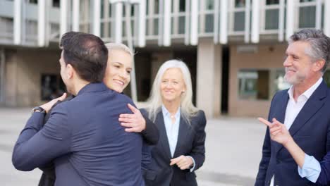business professionals networking and greeting outdoors
