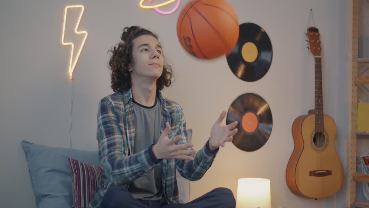 Teenager with Basketball in Cozy Music Room
