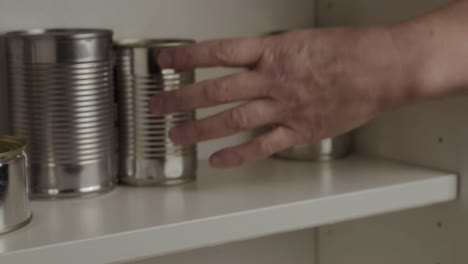 getting aluminum tin cans out of food cupboard shelf